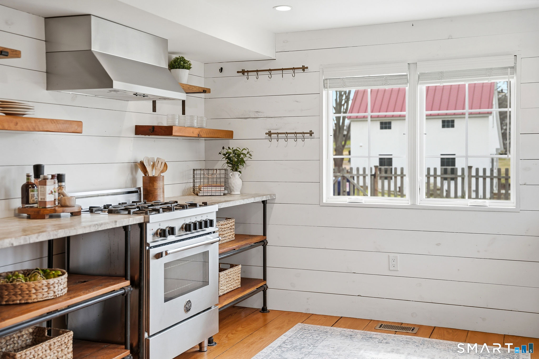 134 Sterling City Road Lyme, CT 06371 - Photo 8 of 38 The thoughtfully positioned kitchen frames views of the detached barn, connecting you to the unique character of the property.