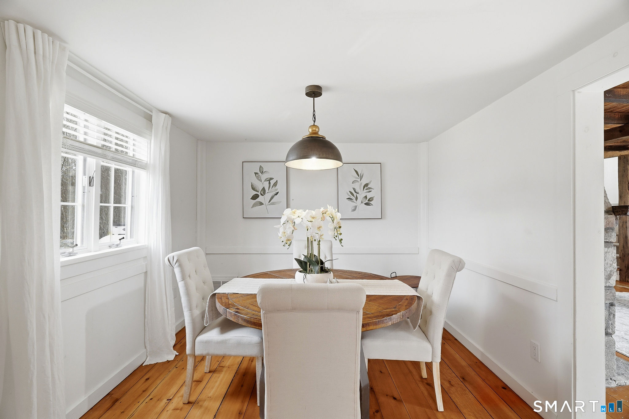 134 Sterling City Road Lyme, CT 06371 - Photo 10 of 38 A thoughtfully placed dining nook off the kitchen blends convenience with comfort for everyday living.