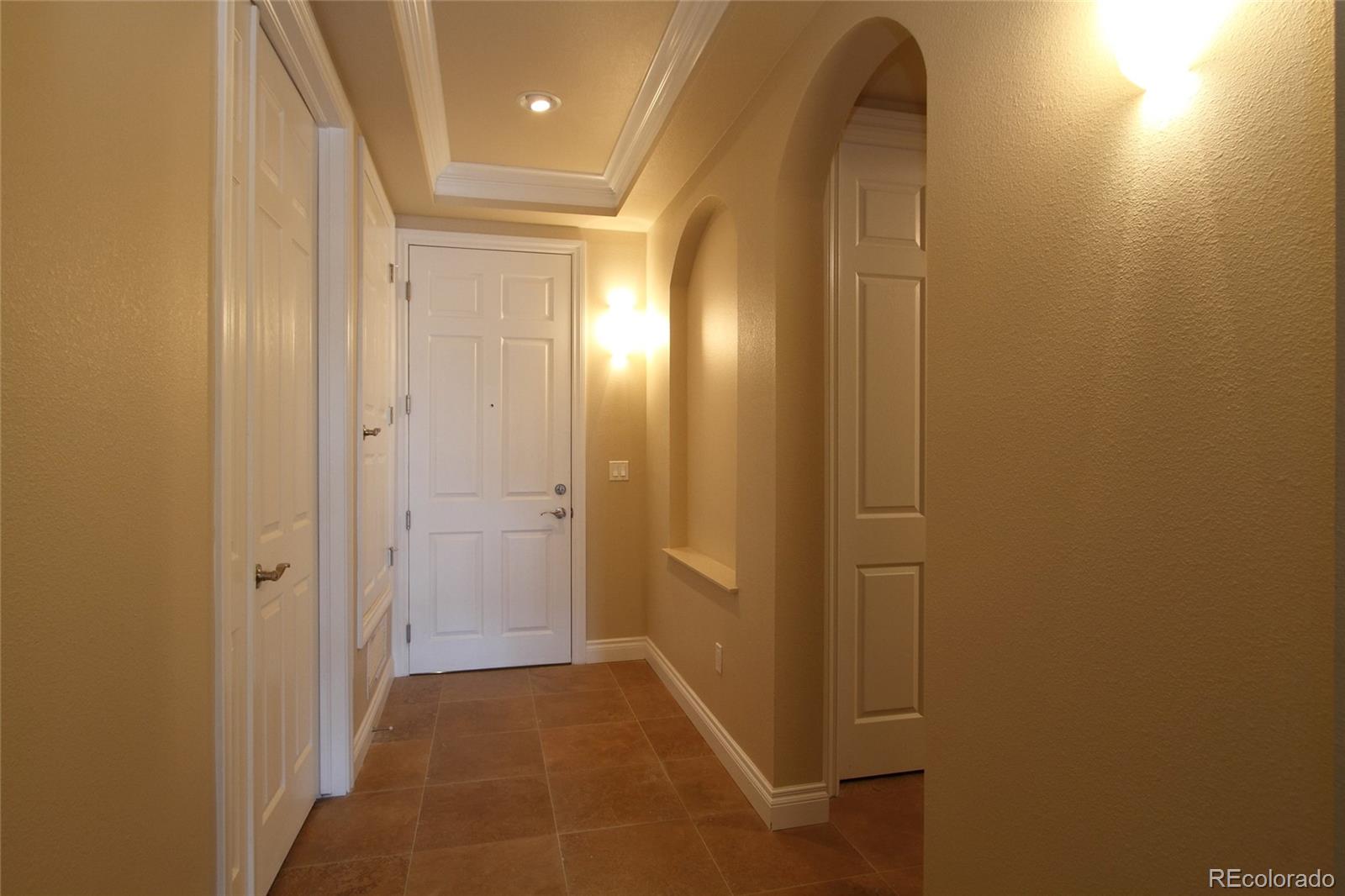 1120 Delaware Street, Unit 311 Denver, CO 80204 - Photo 15 of 25 a view of hallway with a mirror