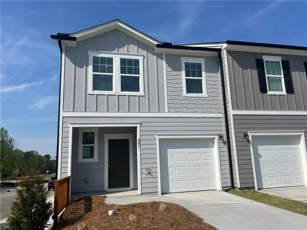 a front view of a house with a garage