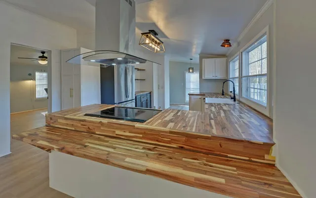 a living room with granite countertop furniture and a fireplace
