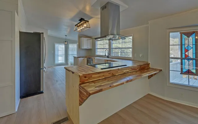 a kitchen with appliances and cabinets
