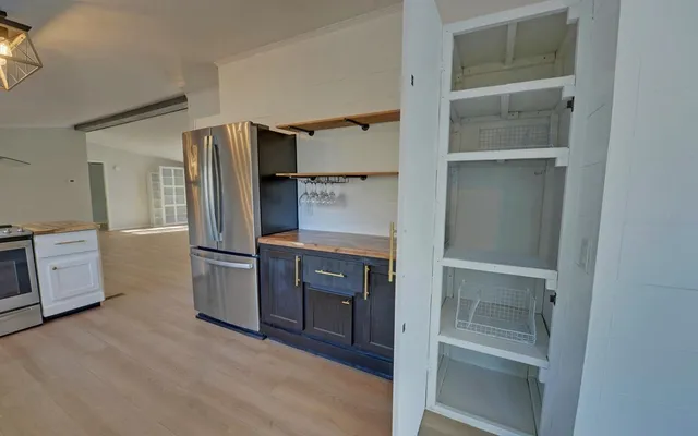 a kitchen with cabinets and stainless steel appliances