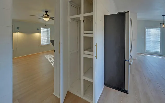 a bathroom with a glass door shower a sink and a mirror