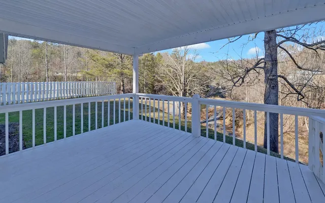 a view of balcony with wooden floor