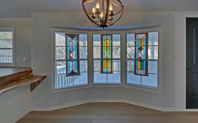 a view of an entryway with wooden floor
