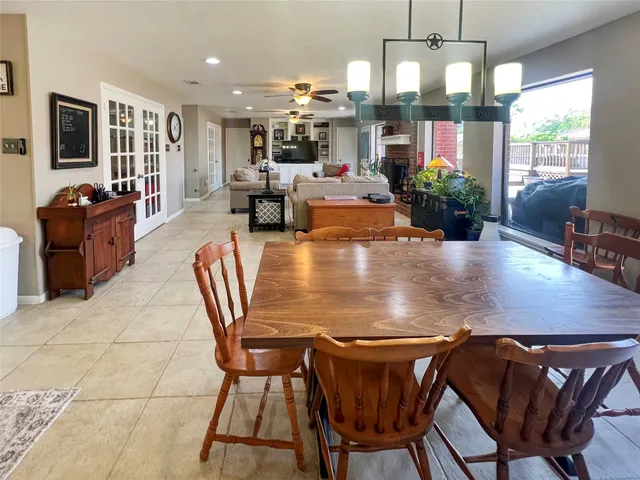 a view of a dining room with furniture and window