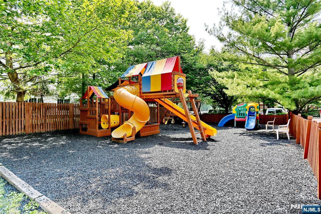 202 Jefferson Court, Unit 202 Edgewater, NJ 07020 - Photo 4 of 6 a view of park with swings