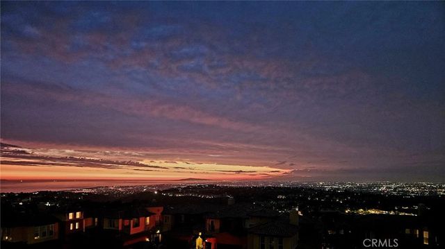 a view of patio with table and chairs and potted plants