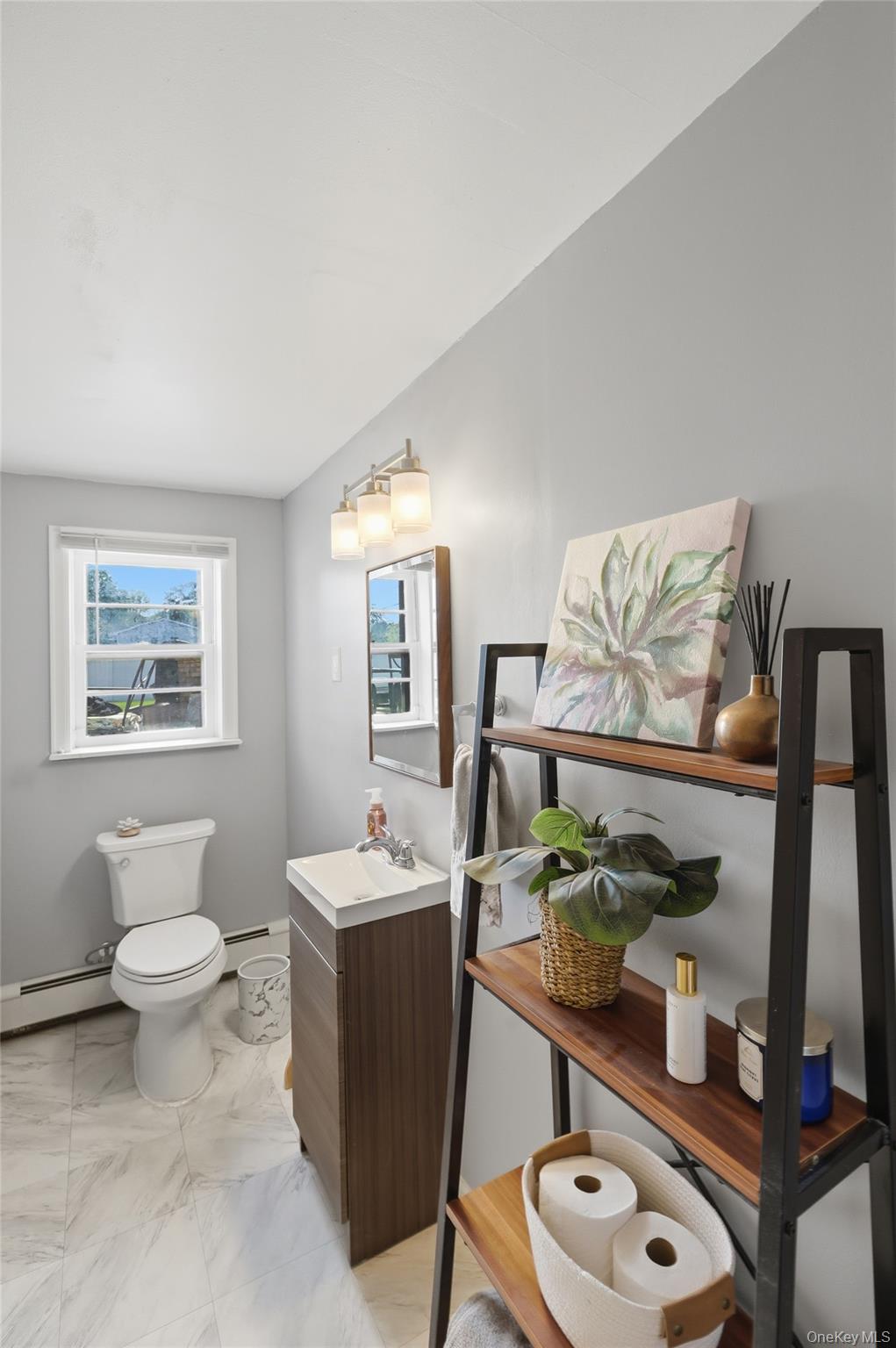 24 Beatty Road Wappingers Falls, NY 12590 - Photo 24 of 36 a bathroom with a sink mirror and vanity