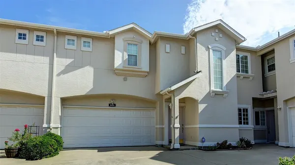 a front view of a house with garage