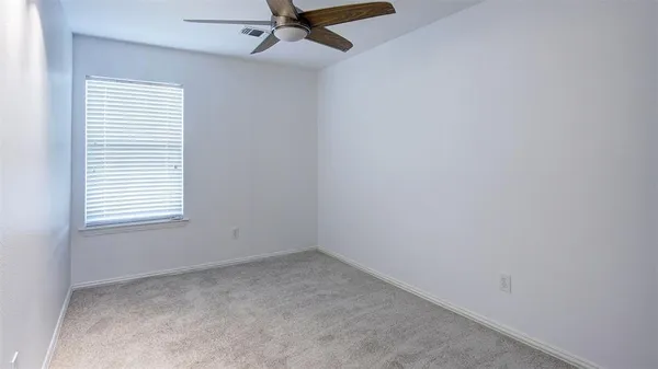 a workspace with furniture and a potted plant