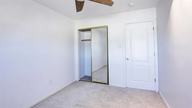 a view of a porch with wooden floor