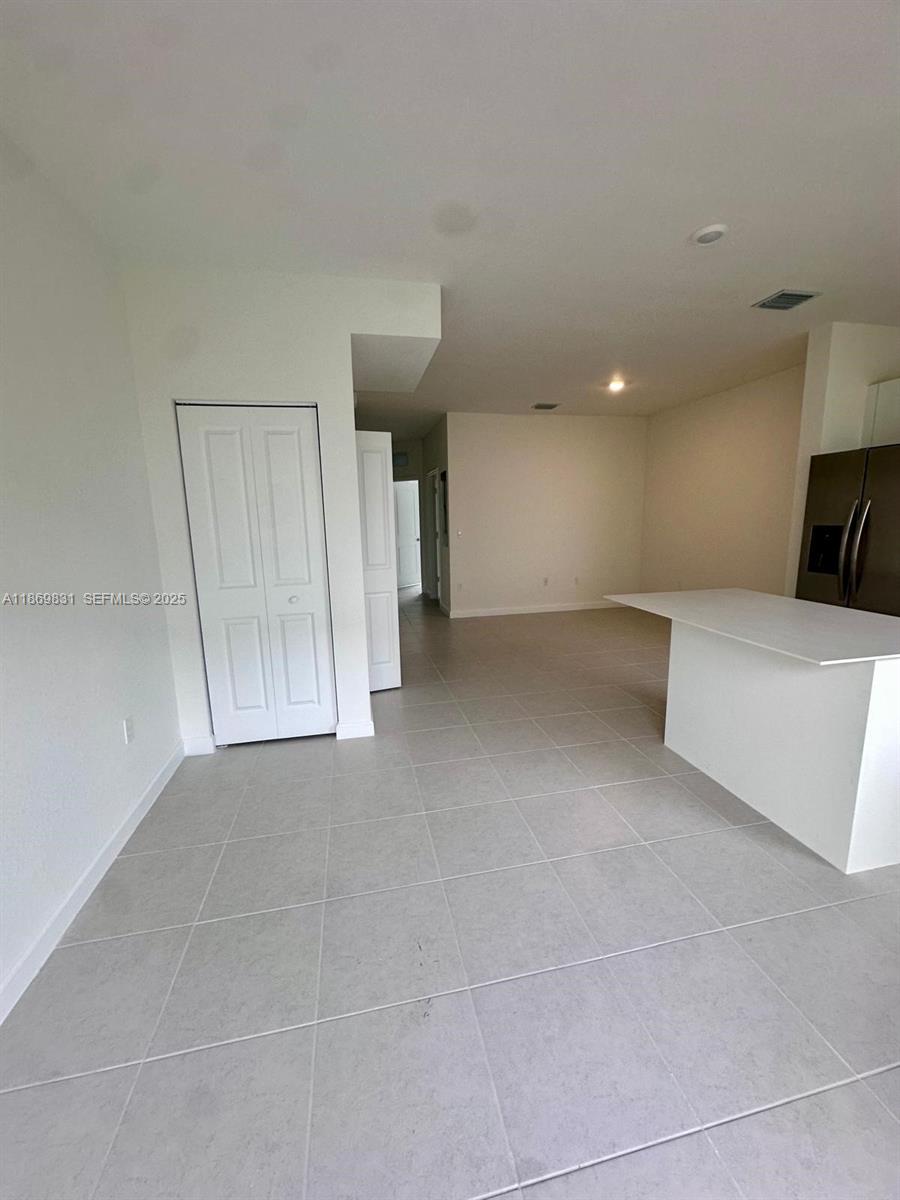 35702 Southwest 178th Court, Unit 35702 Homestead, FL 33034 - Photo 18 of 38 a view of a livingroom and a furniture