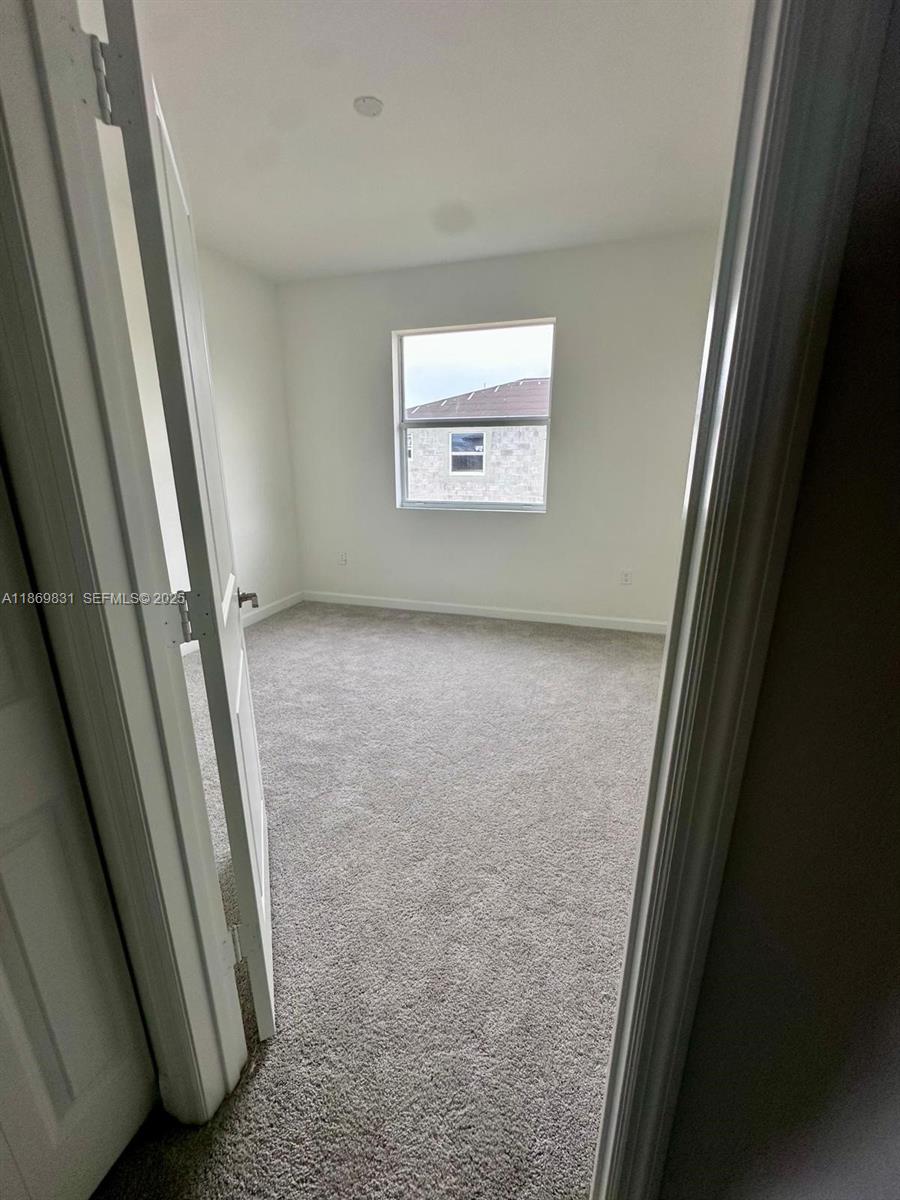 35702 Southwest 178th Court, Unit 35702 Homestead, FL 33034 - Photo 23 of 38 a view of a hallway