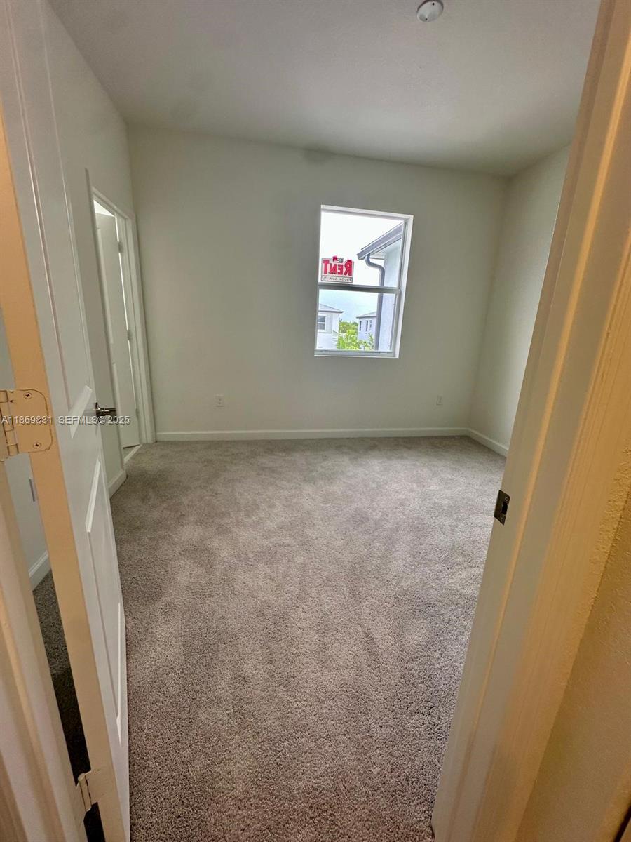 35702 Southwest 178th Court, Unit 35702 Homestead, FL 33034 - Photo 28 of 38 a view of a hallway