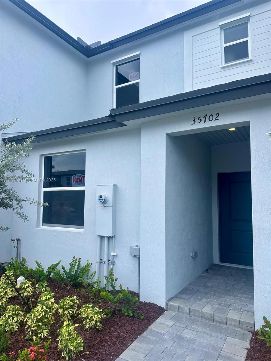 35702 Southwest 178th Court, Unit 35702 Homestead, FL 33034 - Photo 3 of 38 a front view of a house