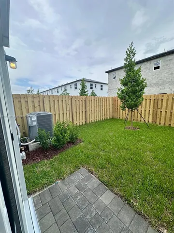 a view of a backyard with garden