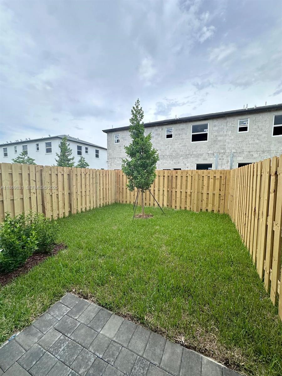 35702 Southwest 178th Court, Unit 35702 Homestead, FL 33034 - Photo 38 of 38 a view of a backyard with garden