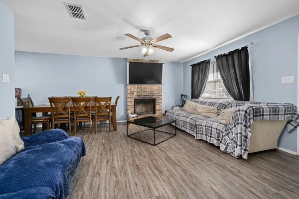 a living room with furniture and a flat screen tv