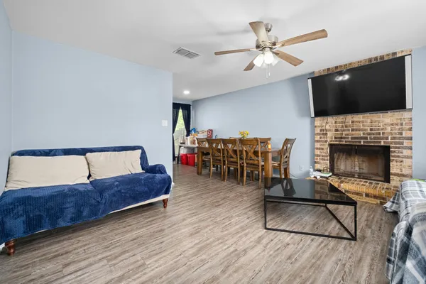 a living room with furniture and a fireplace