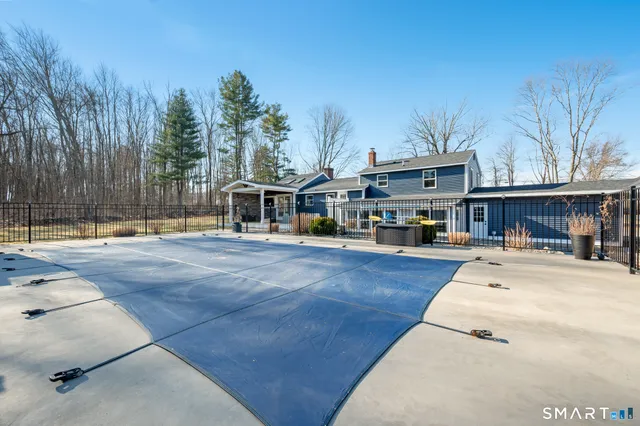 a front view of a building with trees