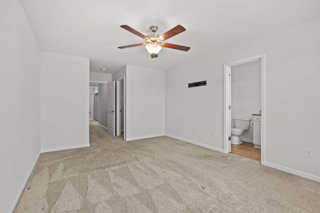 118 Adger Road Pendleton, SC 29670 - Photo 20 of 31 This spacious bedroom offers comfortable carpeting and convenient access to a private bathroom.