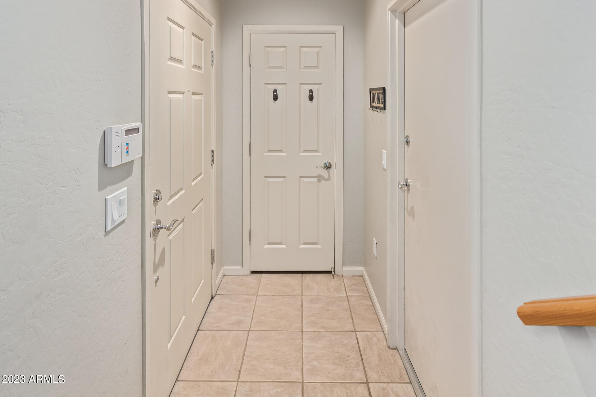 3935 East Rough Rider Road, Unit 1167 Phoenix, AZ 85050 - Photo 4 of 46 Entryway with garage & coat cloest