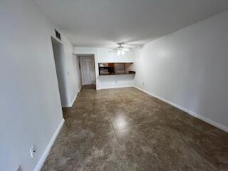 18206 Mediterranean Boulevard, Unit 421 Hialeah, FL 33015 - Photo 3 of 22 a view of empty room with a ceiling fan