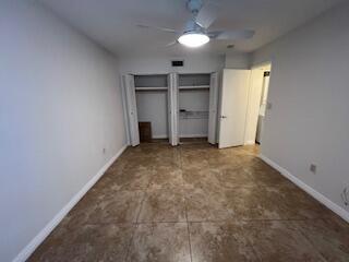 18206 Mediterranean Boulevard, Unit 421 Hialeah, FL 33015 - Photo 8 of 22 an empty room with closet and windows