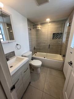 18206 Mediterranean Boulevard, Unit 421 Hialeah, FL 33015 - Photo 9 of 22 a bathroom with a sink a toilet and shower