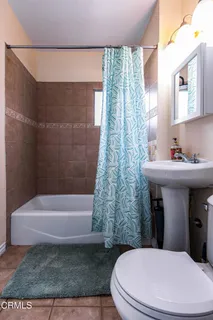 a bathroom with a sink toilet and bathtub