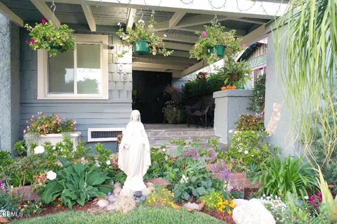 a house with a flower garden