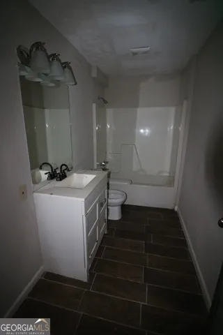 a bathroom with sink and mirror