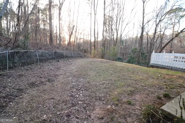 a backyard of a house with lots of green space