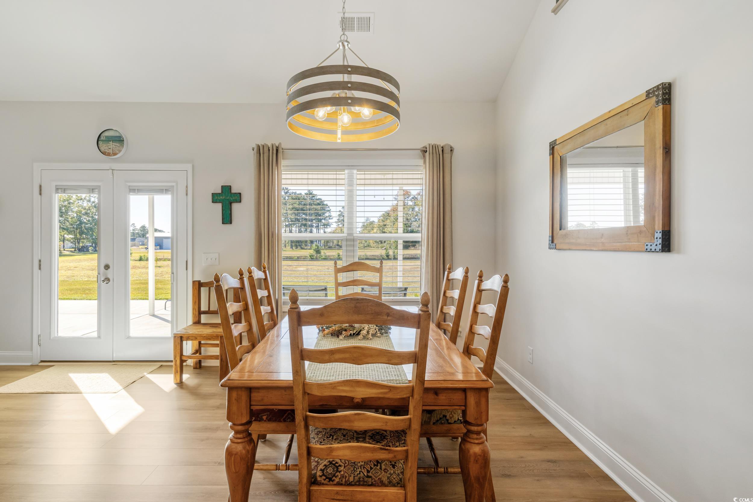 4082 Salem Road Aynor, SC 29511 - Photo 17 of 39 Dining area featuring french doors, wood-type floo