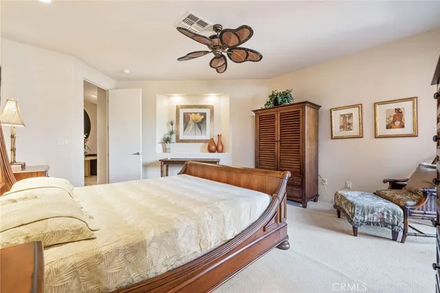 a bedroom with a bed and dresser