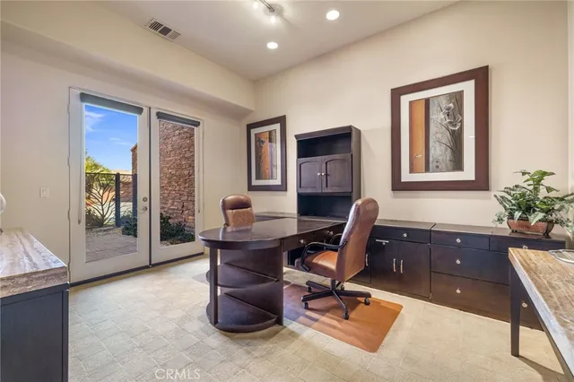 a view of a workspace with furniture