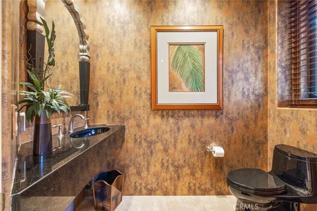 a utility room with sink washer and dryer