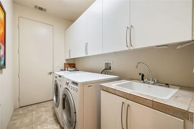 a view of a dining room with furniture and a potted plant