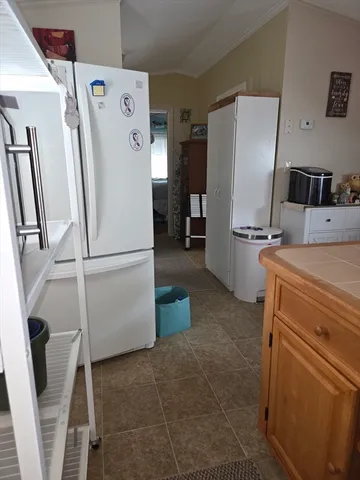 a kitchen with a refrigerator and a stove