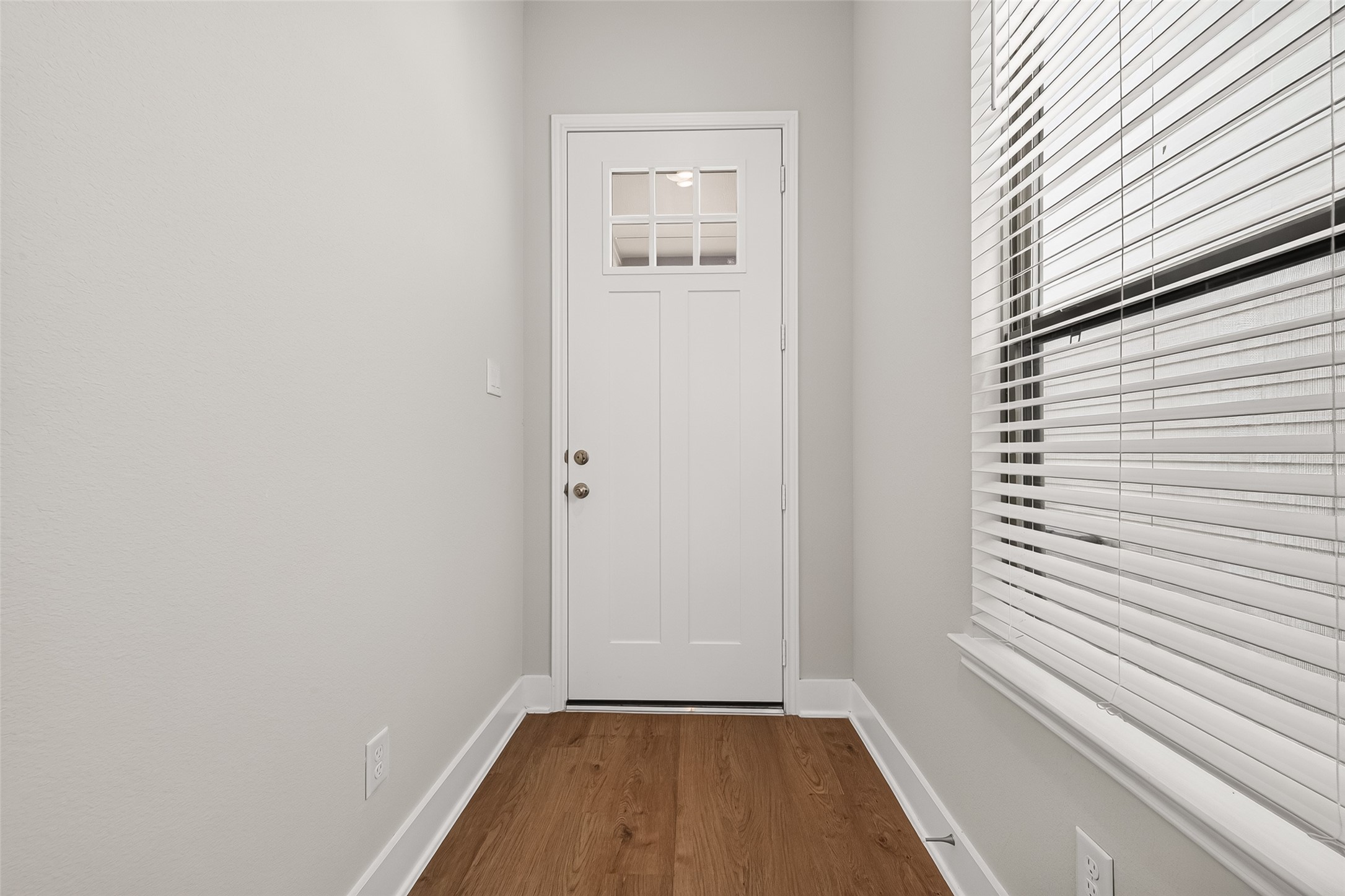4004 Baja Lane Houston, TX 77045 - Photo 5 of 34 Light, bright, and completely inviting. An impressive large window illuminates the foyer, casting a warm glow across the beautiful modern vinyl flooring and creating an expansive, cheerful entryway that instantly makes you feel right at home.