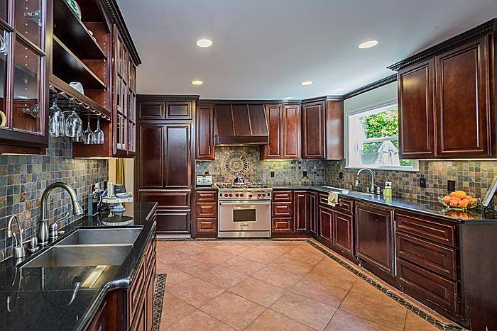 27 Clarendon Road Burlingame, CA 94010 - Photo 8 of 21 a kitchen with granite countertop stainless steel appliances a sink and cabinets