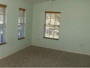 2816 Digby Road Southeast Palm Bay, FL 32909 - Photo 4 of 4 an empty room with windows