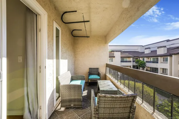 a view of balcony with furniture