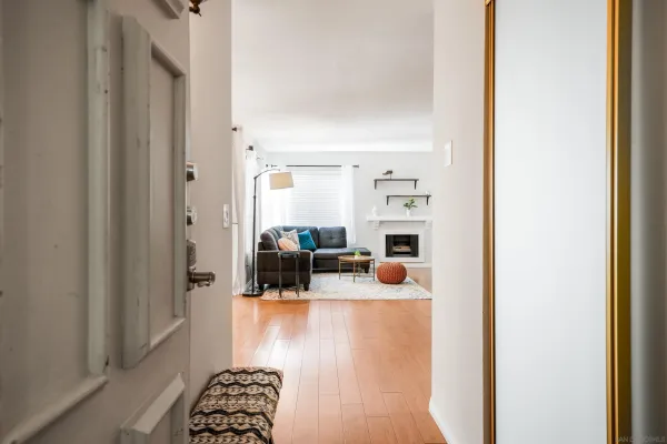 a view of living room with furniture and a window