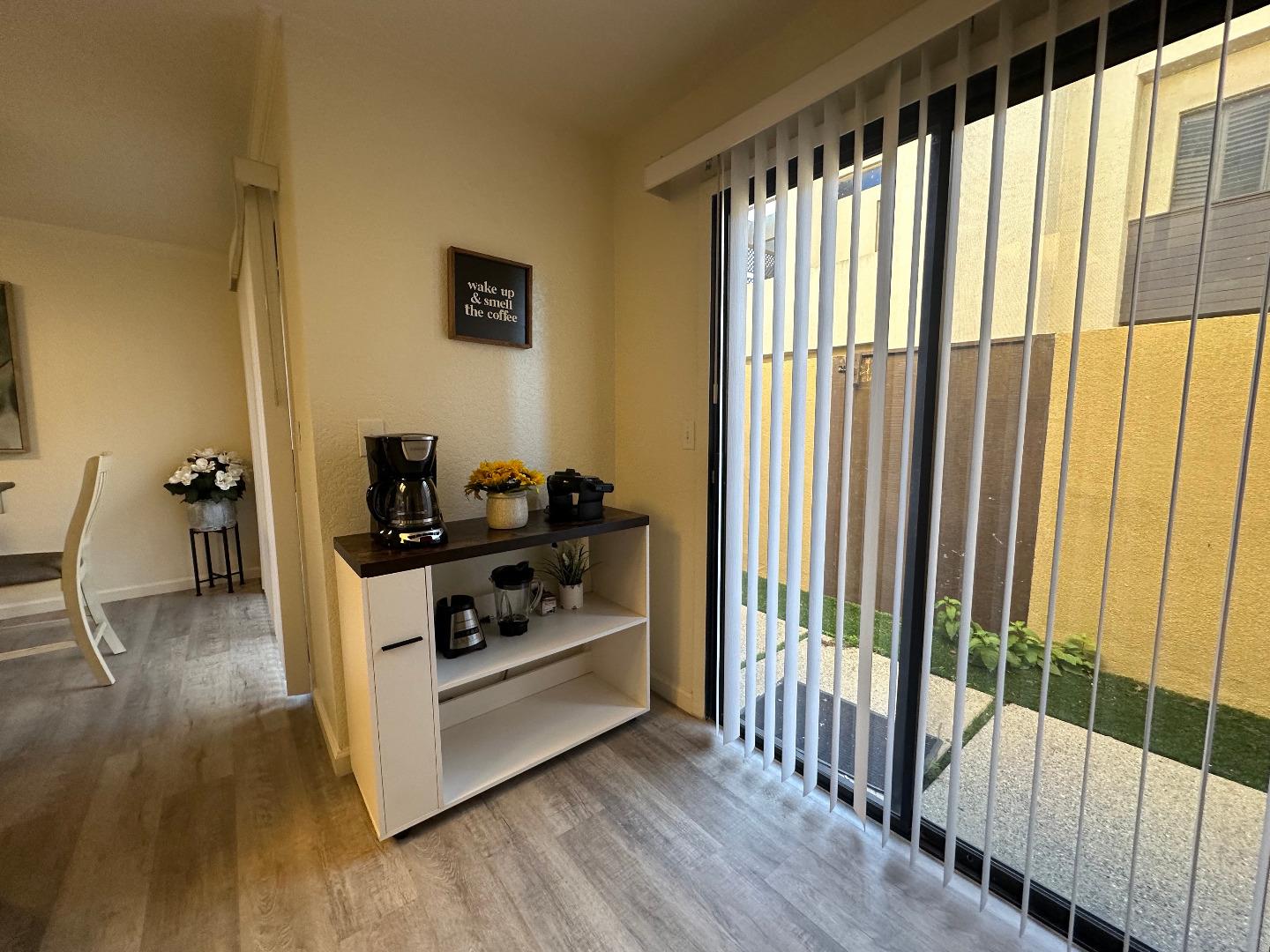 1067 Padre Drive, Unit 1 Salinas, CA 93901 - Photo 13 of 14 a kitchen with wooden floor and furniture