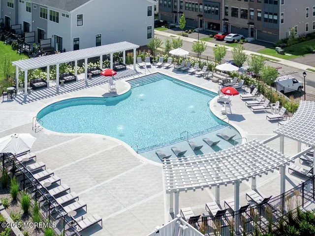 a view of a house with swimming pool and chair