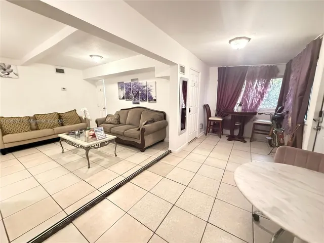 a living room with furniture and a couch