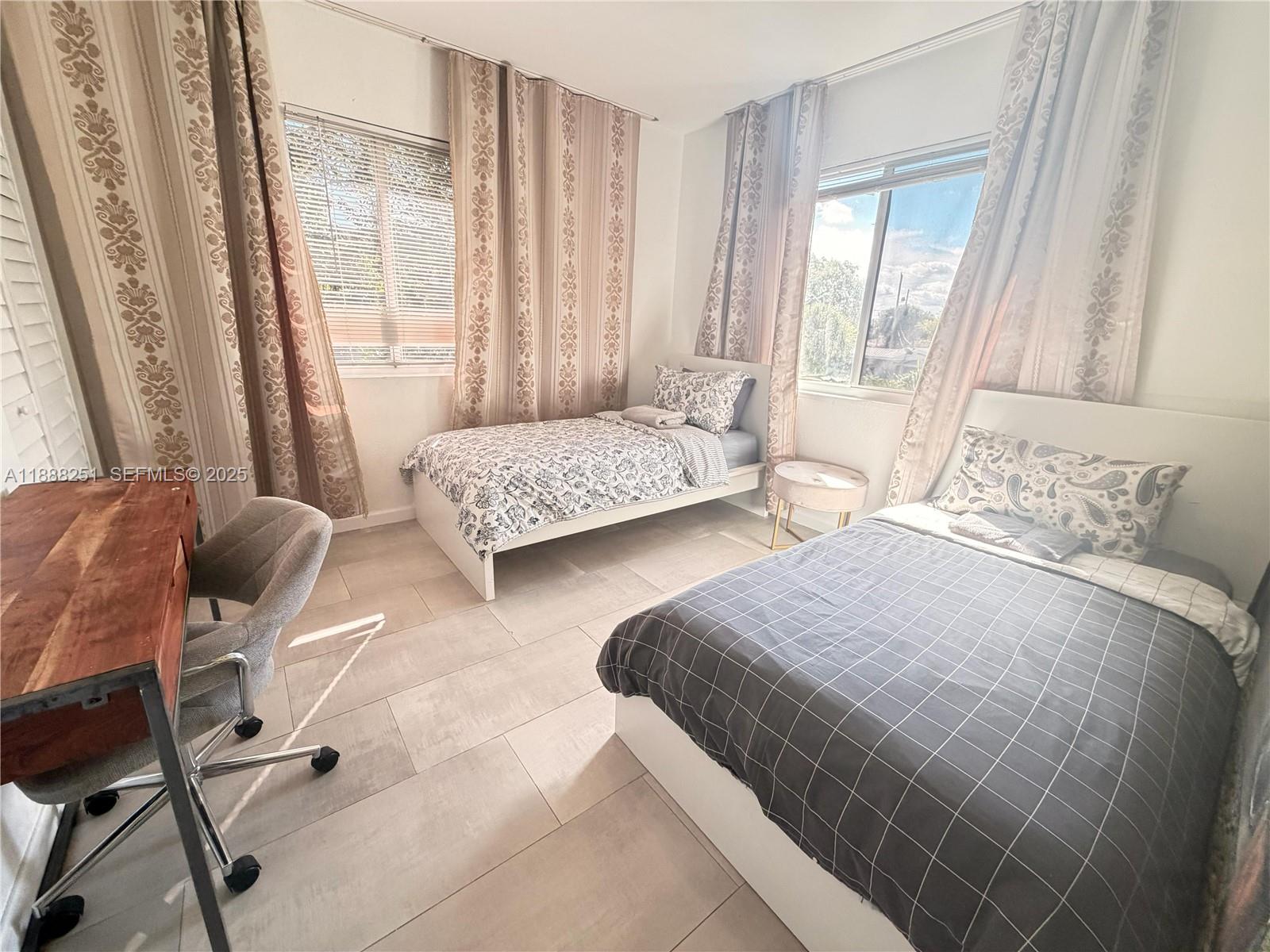 3 Southwest 7th Avenue Dania Beach, FL 33004 - Photo 23 of 25 a bedroom with two beds and large window